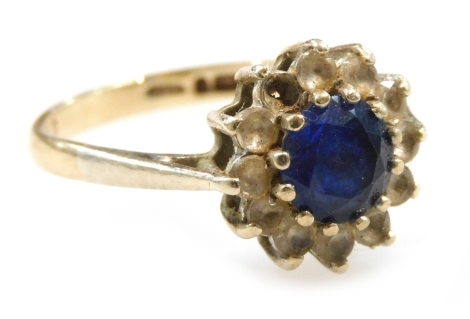 A 9ct gold sapphire and white sapphire set flower head ring, one stone lacking, size O/P, 2.7g.