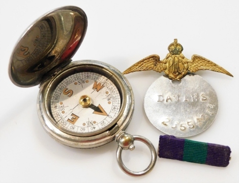 A World War One military compass 1918, stamped Terrasse.W.Co VI, 69310, a dog tag named to Davies, 23554014, RAF wings brooch, and a General Service Medal ribbon bar. (4)