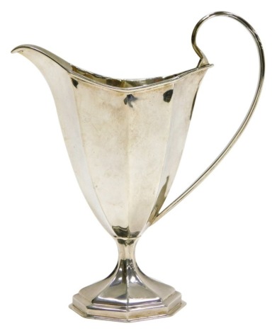 A Victorian silver helmet shaped cream jug, of octagonal form, William Aitken, Chester 1899, 3.26oz, 15cm high.