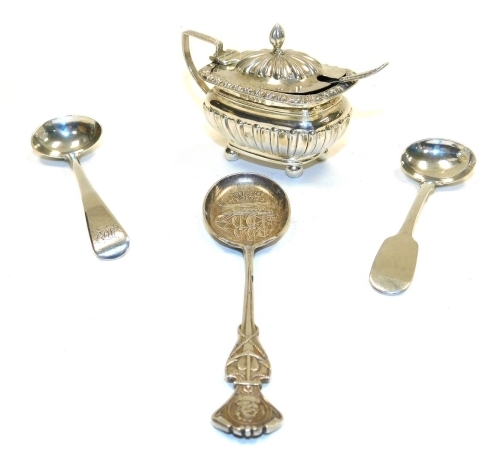 A group of small silver, comprising an Edward VII silver mustard pot, part fluted with blue glass liner, William Neal, Chester 1902, together with a salt spoon, two mustard spoons and a Victorian souvenir spoon commemorating the Pelican ship 1577-1589, we