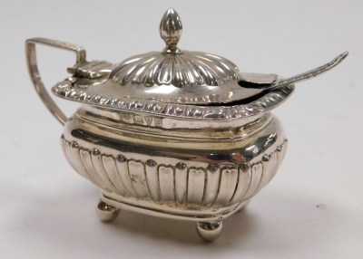 A group of small silver, comprising an Edward VII silver mustard pot, part fluted with blue glass liner, William Neal, Chester 1902, together with a salt spoon, two mustard spoons and a Victorian souvenir spoon commemorating the Pelican ship 1577-1589, we - 8