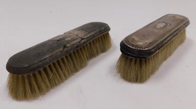 An Edward VII silver backed three piece dressing table set, comprising hand mirror, hair brush and comb, each piece engraved with scrolls and leaves, Chester 1901, together with two further silver backed clothes brushes. - 5