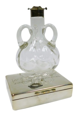 An early 20thC silver mounted blown glass decanter, with flared triform lip, the body of baluster form with three handles, lacking stopper, Chester 1902, 18cm high, together with an Aquascutum silver plated commemorative box for Allied Dunbar, of rectangu