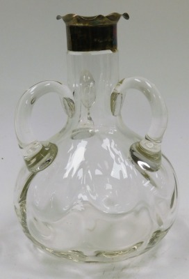 An early 20thC silver mounted blown glass decanter, with flared triform lip, the body of baluster form with three handles, lacking stopper, Chester 1902, 18cm high, together with an Aquascutum silver plated commemorative box for Allied Dunbar, of rectangu - 2