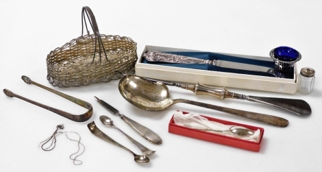 A group of small silver, to include a Viners silver handled Kings pattern cheese knife, boxed, an integrated shoehorn and button hook, pierced open salt with blue glass liner, pair of Georgian sugar tongs, serving spoon stamped St Louis 925, etc., weighab