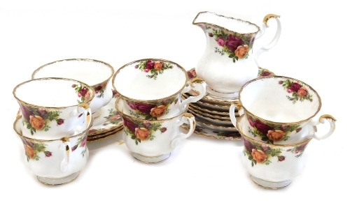 A group of Royal Albert Old Country Roses porcelain part tea wares, comprising six teacups and saucers, milk jug, sugar bowl, and four tea plates.