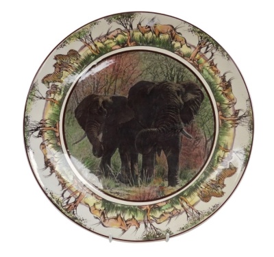 A Royal Doulton pottery charger, African elephants, from the South African series, D6365, 34cm diameter.