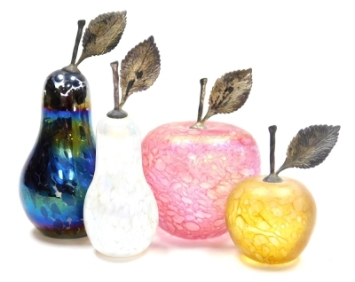 Four iridescent glass paperweights, possibly by John Ditchfield, two in the form of pears and two in the form of apples, each with silver coloured stalks, height of largest pear 11cm high, height of largest apple 8.5cm high.