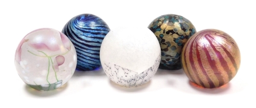 Five Isle of Wight glass orb paperweights, each of differing design and colourway, bearing paper labels, each 4.5cm high, all boxed.