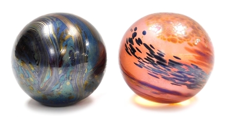 Two Glasform iridescent glass orb paperweights, each signed Glasform and initialled, 7cm high.