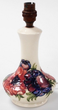 A Moorcroft Anemone pattern pottery table lamp, against a white ground, impressed marks, 26.5cm high.