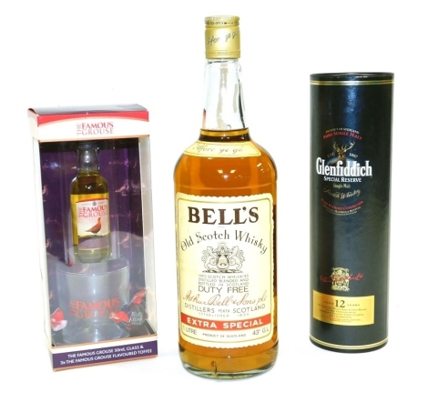 A bottle of Bells Old Scotch whisky, 1 litre, together with a bottle of Glenfiddich Special Reserve single malt 12 years Scotch whisky, 35cl, in box, and a Famous Grouse gift set.