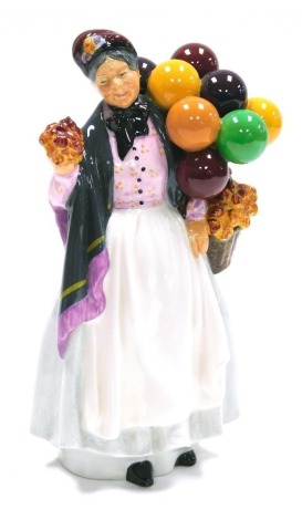 A Royal Doulton pottery figure modelled as Biddy Penny Farthing, HN1843, printed marks, 22cm high.