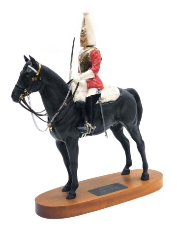 A Beswick Connoisseur model of Lifeguard, a trooper in mounted review order dressed for ceremonial duties, mounted on an oval hardwood base, 37cm high.