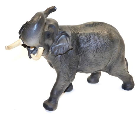 A Beswick matt pottery figure, modelled as an elephant, printed marks, 29cm high.