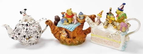 Three Disney pottery teapots, comprising Disney Showcase Collection Winnie The Pooh birthday cake, limited edition number 97/250, Winnie The Pooh, limited edition 875/5000 (AF), together with 101 Dalmatians. (3)