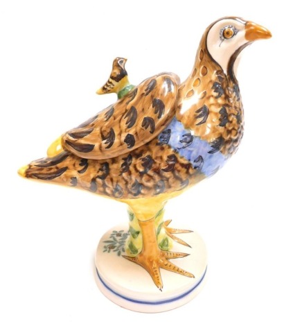 A Continental faience pottery tureen and cover, modelled in the form of a partridge, signed to underside GM NI 5, 28cm high.