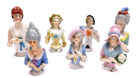 Seven Art Deco and Gainsborough lady porcelain pin dolls, in varying costumes.