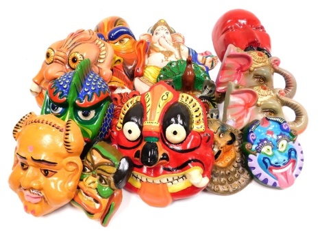 A group of Indian papier mache masks, to include elephant, various demonic faces, Ganesh, etc. (1 tray)