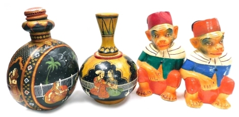 A group of Indian related items, comprising a pair of papier mache lidded containers modelled as seated monkeys in a fez, 31cm high, a painted tin vessel of compressed globular form, painted with figures in interior settings with lid, 35cm high, together 