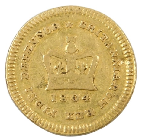 A George III gold Third Guinea, 1804, (second head), 2.8g.