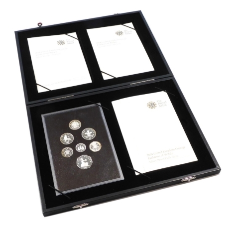 A Royal Mint 2008 United Kingdom Coinage Emblems of Britain silver proof collection, the fitted case containing seven silver coins, number 4925, with certificate of authenticity, along with further pamphlets, sold with cardboard sleeve and outer cardboard