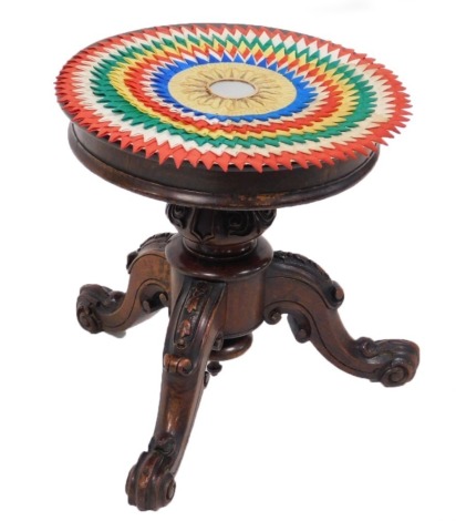 A Victorian mahogany piano stool, the circular revolving top raised on a scroll and leaf carved column, on three ornately carved cabriole legs, lacking overstuffed seat, 38cm high.