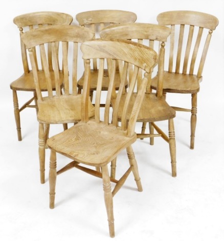 A set of six beech and elm kitchen chairs, each with a slatted back, solid seat on turned cylindrical legs united by H shaped stretcher.