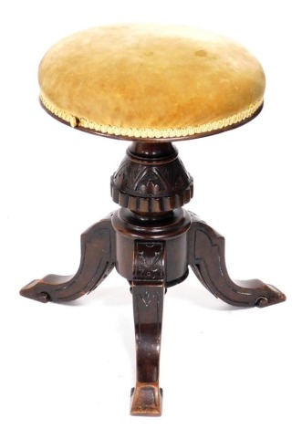 A Victorian mahogany piano stool, upholstered in overstuffed gold draylon, above a carved column over three cabriole legs, 43cm high.