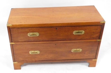 A mahogany campaign chest, of two drawers, with brass handles and corner plates, raised on bracket feet, 61cm high, 95cm wide, 39cm deep.