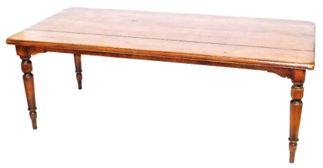 A late 19thC fruit wood plank top dining table, raised on turned legs, 76cm high, 214cm wide, 97cm deep.