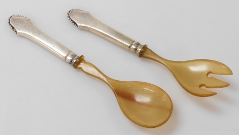 A pair of Christian Heise Danish horn and silver handled salad servers.