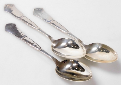 Three Christian Heise Danish silver tablespoons, each with a shaped hammered handle with beaded decoration, 4.27oz.