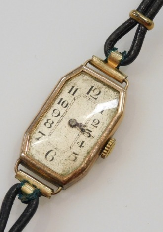 An early 20thC lady's 9ct rose gold cased wristwatch, octagonal silvered dial bearing Arabic numerals, fifteen jewelled movement, on a leather strap.