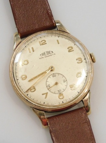 A Trebex gentleman's 9ct gold cased wristwatch, circular champagne dial bearing Arabic numerals, subsidiary seconds dial, the case back presentation engraved, on a leather strap.