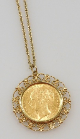 A Queen Victoria young head full sovereign 1887, in a yellow metal filigree mount, indistinctly stamped, with a 9ct gold neck chain, 15.4g.