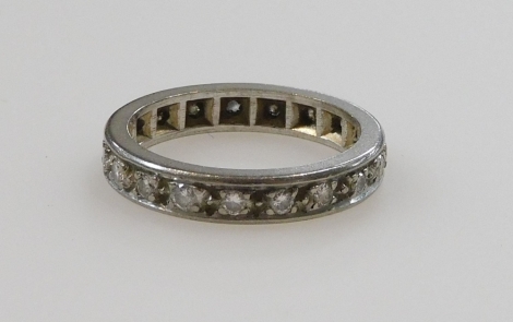 A diamond full eternity band, set in white metal, size K, 4.1g.