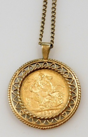 An Edward VII gold full sovereign 1904, in a 9ct gold pendant mount, on a 9ct gold curb link neck chain on a bolt ring clasp, 19.4g.