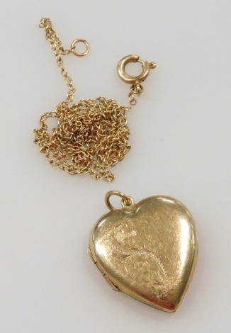 A 9ct gold heart shaped photo locket, with engraved foliate decoration, and a 9ct gold belcher link neck chain, on a bolt ring clasp, 3.9g.