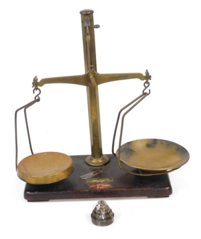 A set of W & T Avery Ltd Birmingham brass apothecary scales, with a set of brass weights, 42cm high.