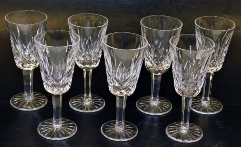 A set of seven Waterford crystal Lismore pattern sherry glasses, each 13.5cm high.