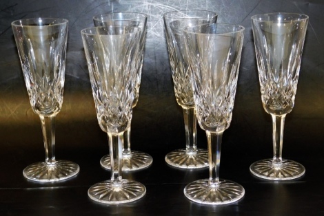 A set of six Waterford crystal Lismore pattern champagne flutes, each 19cm high, boxed.