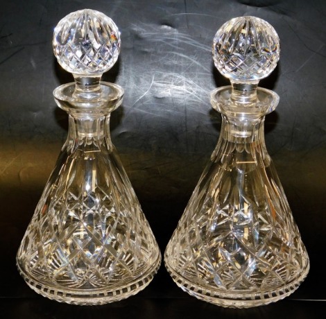 A pair of Waterford crystal Lismore pattern decanters, each of cylindrical tapering form, with stoppers, 17cm high, both boxed.