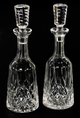 A pair of Waterford crystal Lismore pattern mallet shaped decanters, 33cm high, both boxed.