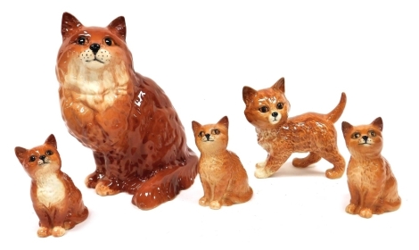 Five Beswick pottery figures modelled as ginger cats, and kittens, the largest 21cm high.