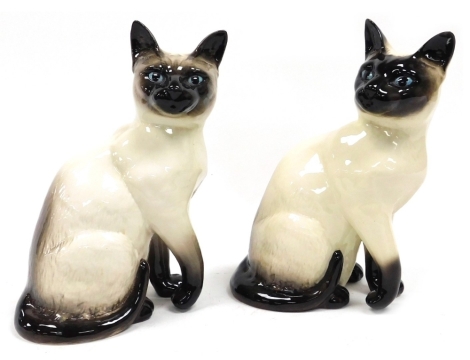 Two Beswick pottery figures modelled as Siamese cats, each 23cm high.