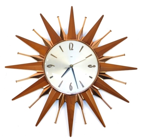 A mid century Metamec teak and copper sunburst wall clock, with Arabic and baton numeral dial, quartz movement, 44cm diameter.