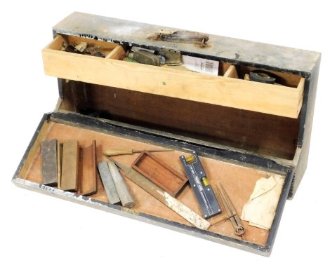 A stained pine toolbox, the hinged lid opening to reveal a fitted box and recess, enclosing some tools, 80cm wide.