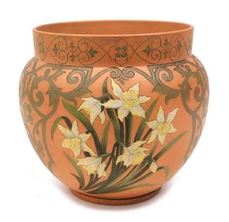 A Victorian terracotta jardiniere, of cylindrical tapering form, with incised decoration of daffodils, scrolls, further flowers, etc., 31cm high, 36cm diameter.