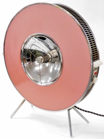 A mid century stainless steel and pink fan heater, of circular form, on four splayed legs, 70cm high. Buyer Note: WARNING! This lot contains untested or unsafe electrical items. It is supplied for scrap or reconditioning only. TRADE ONLY